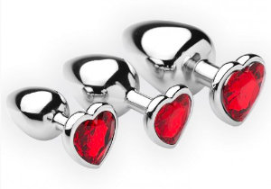 Metalen buttplug set met rode hartvormige siersteen